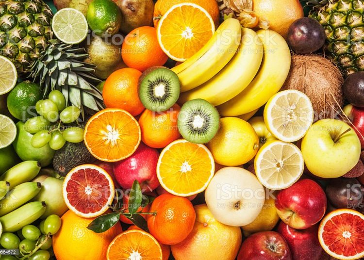 Fresh fruit background. Healthy eating and dieting concept. Winter assortment. Top view